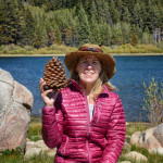 A woman holding a pinecone  