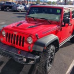 The front of a red Jeep