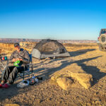 A man camping at Alstrom Point