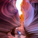 A man and woman exploring the Antelope Canyon