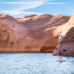 A person paddle boarding at Lake Powell  