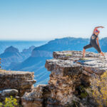 A woman stretching at the North Rim of the Grand Canyon