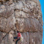 A man climbing a rock
