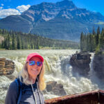 A woman posing near the Athabasca Falls  