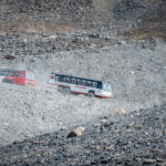 Buses driving at rocky terrain