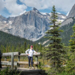 A woman at the bridge of Emerald Lake