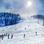 People skiing down a mountain  