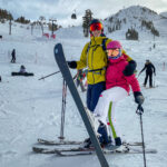 Two people having fun while skiing