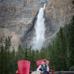 A woman sitting on a chair overlooking the Takakkaw Falls