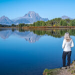 A woman looking at the Grand Teton National Park 