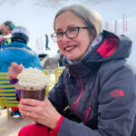 A woman holding a chocolate drink