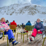 Two women in a resting area in a ski resort