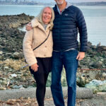 A man and woman on a rocky beach